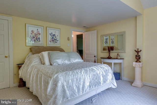 bedroom with baseboards, visible vents, and carpet floors