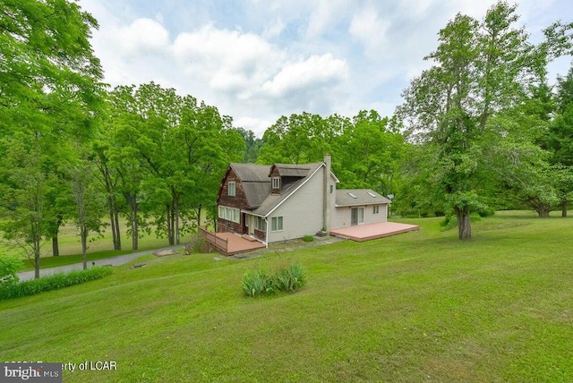 exterior space with a yard and a deck