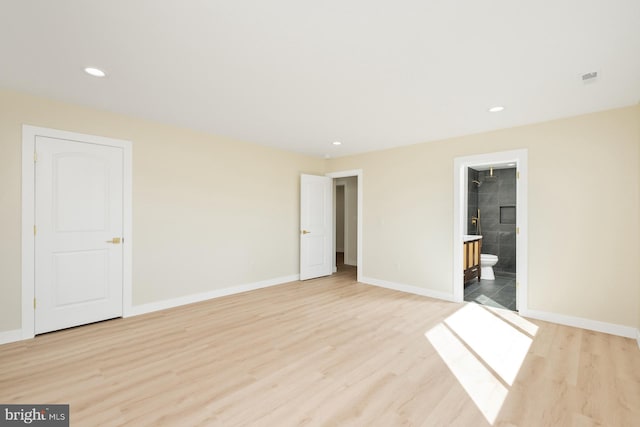 unfurnished bedroom with recessed lighting, baseboards, and light wood-style floors