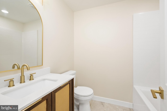 full bath featuring toilet, vanity, and baseboards