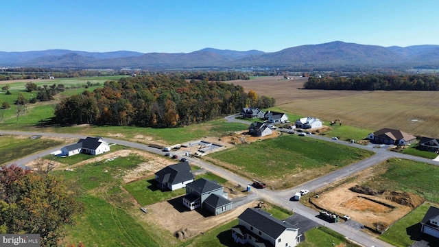 aerial view with a mountain view and a rural view