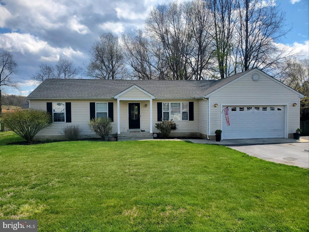 ranch-style house with a garage, concrete driveway, a front yard, and a shingled roof