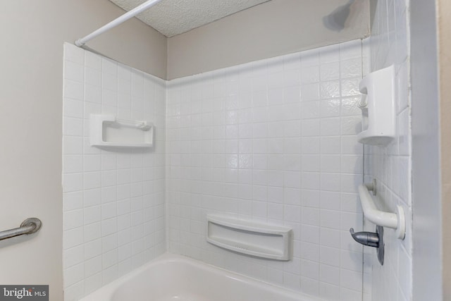 full bath featuring shower / tub combination and a textured ceiling