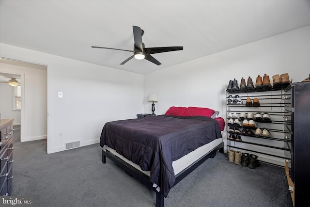 bedroom featuring visible vents, carpet flooring, baseboards, and ceiling fan