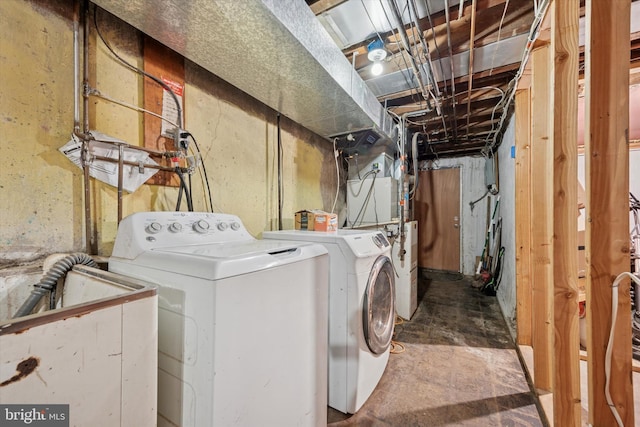 washroom with washer and clothes dryer and laundry area