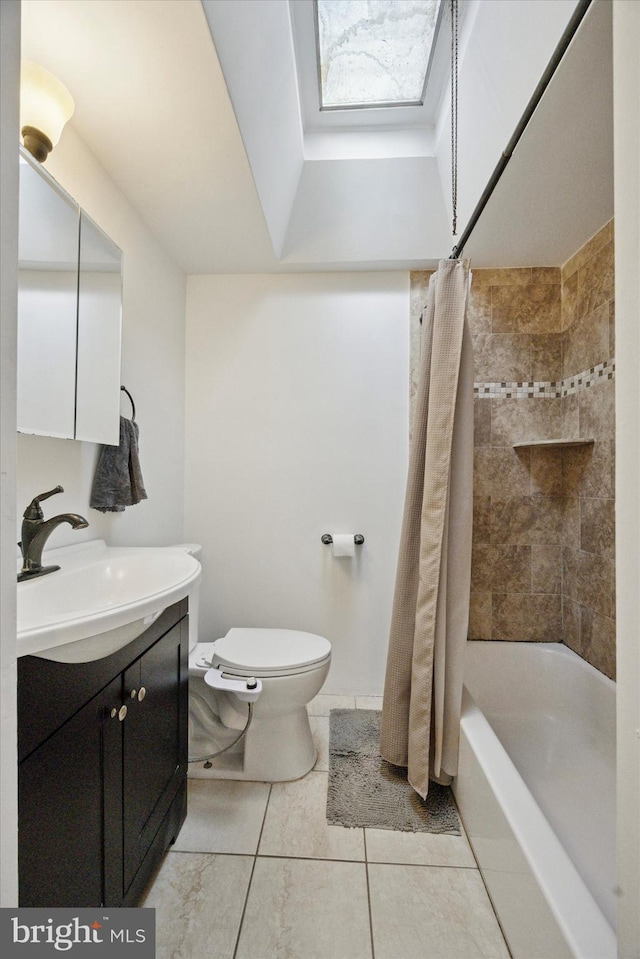 bathroom featuring vanity, shower / bathtub combination with curtain, a skylight, tile patterned floors, and toilet