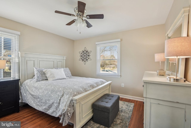 bedroom featuring baseboards, dark wood-style flooring, and ceiling fan