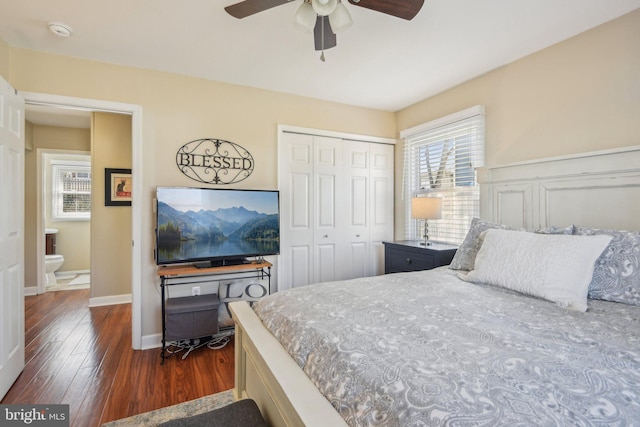 bedroom with dark wood finished floors, baseboards, a closet, and ceiling fan