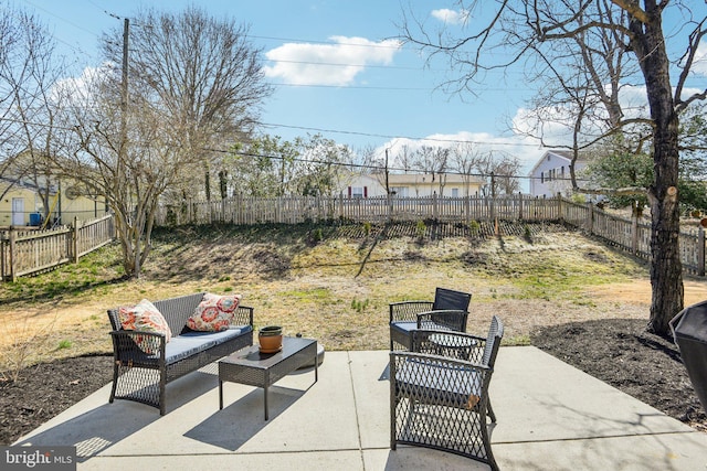 view of patio with an outdoor hangout area and a fenced backyard