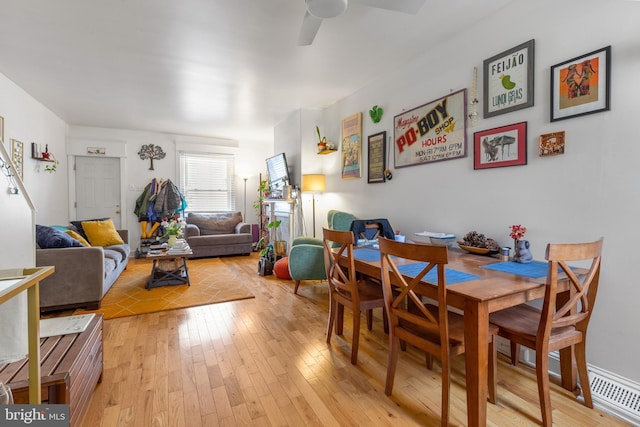 dining room featuring light wood-type flooring and ceiling fan