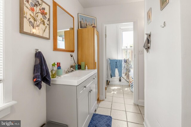 bathroom with tile patterned floors and vanity
