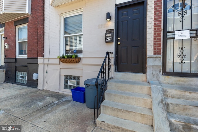 entrance to property with brick siding
