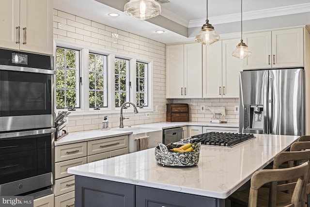 kitchen with ornamental molding, light stone countertops, backsplash, and stainless steel appliances