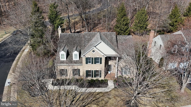 view of front of home featuring a chimney