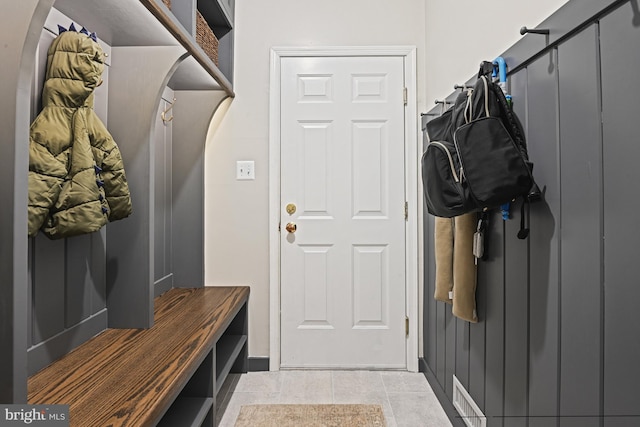 mudroom featuring light tile patterned floors and visible vents