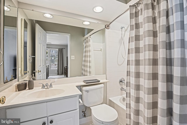 bathroom with recessed lighting, toilet, vanity, and shower / bath combo with shower curtain