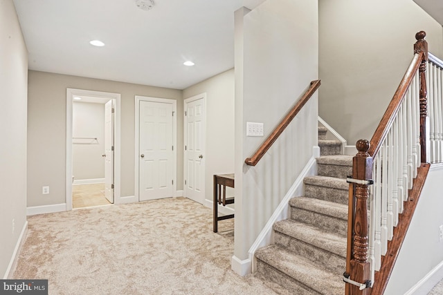 staircase with carpet flooring, recessed lighting, and baseboards