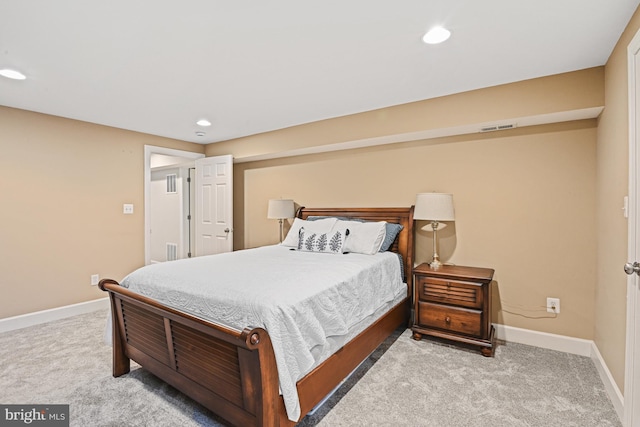 carpeted bedroom featuring recessed lighting, baseboards, and visible vents