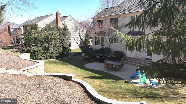 view of yard with entry steps and a patio area