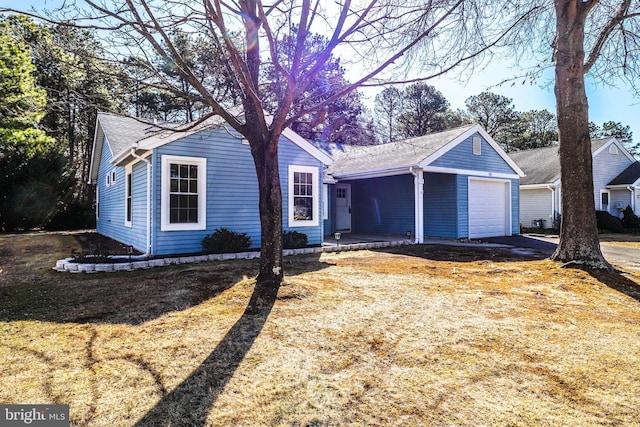 ranch-style house with a shingled roof and a garage