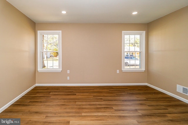 unfurnished room with recessed lighting, visible vents, and plenty of natural light