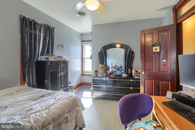 carpeted bedroom featuring visible vents, ceiling fan, and baseboards