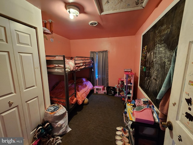 carpeted bedroom featuring visible vents