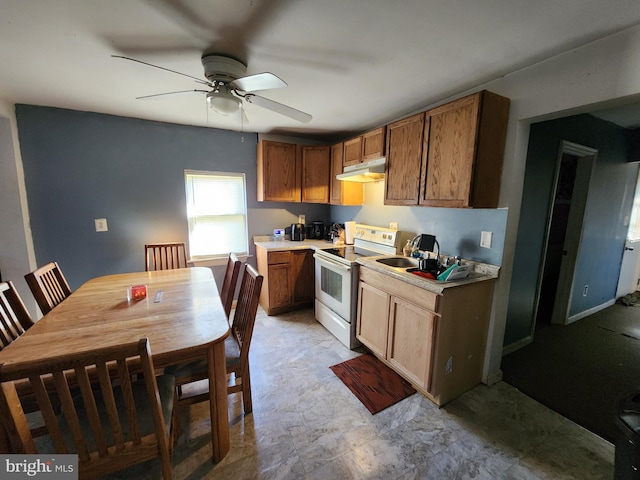 kitchen featuring ceiling fan, a sink, light countertops, under cabinet range hood, and white electric range