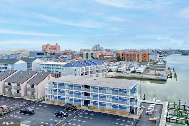 drone / aerial view featuring a water view and a city view