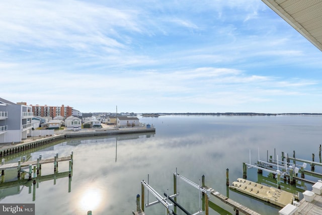 view of dock featuring a water view and boat lift