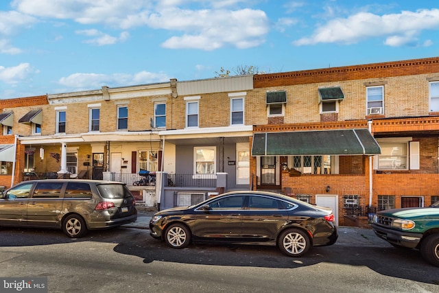 townhome / multi-family property featuring brick siding