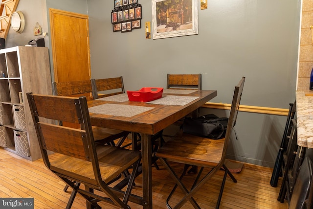 dining area with light wood-style flooring