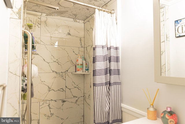 interior details featuring a shower with shower curtain