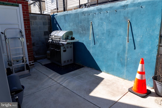 exterior space with grilling area and fence