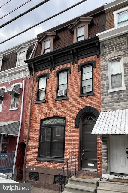 multi unit property featuring brick siding