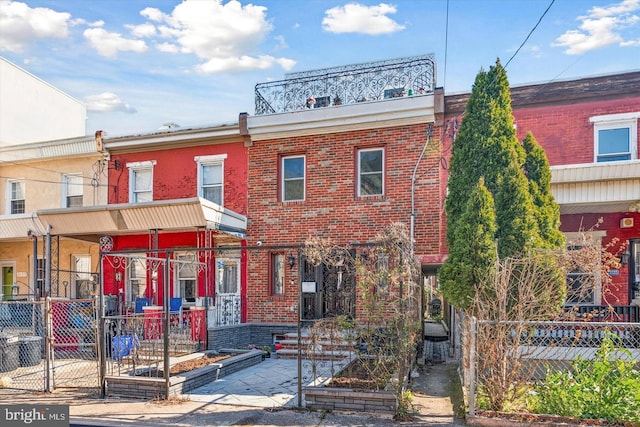 multi unit property with brick siding and fence