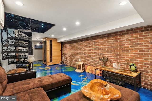 living area with recessed lighting and brick wall