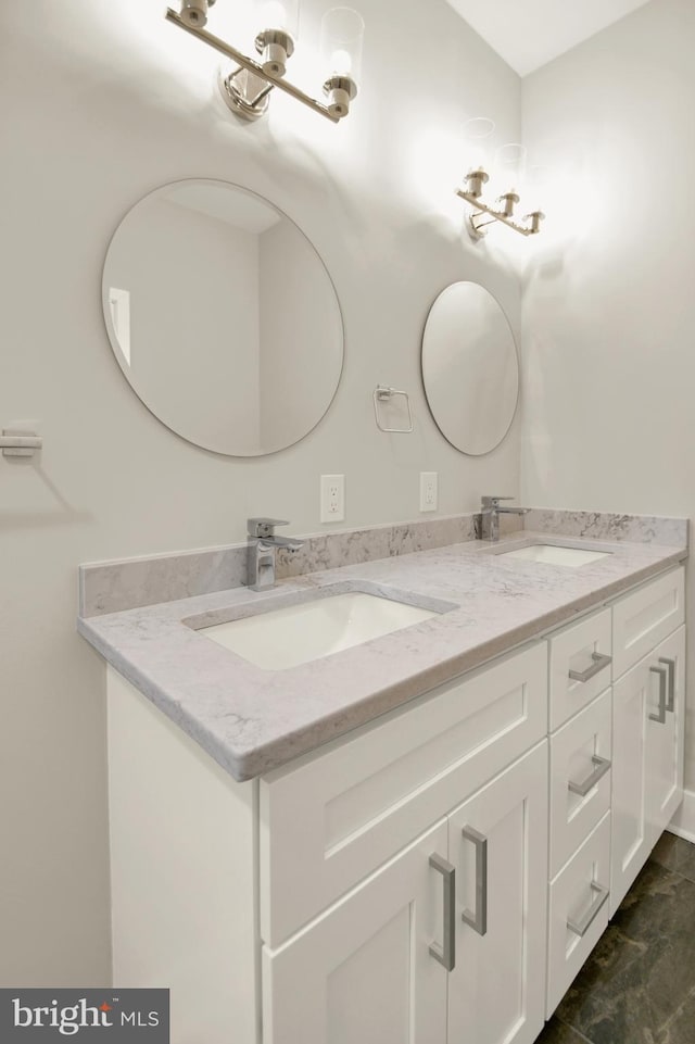 full bathroom featuring double vanity and a sink