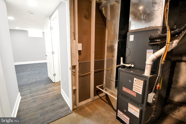 utility room featuring heating unit