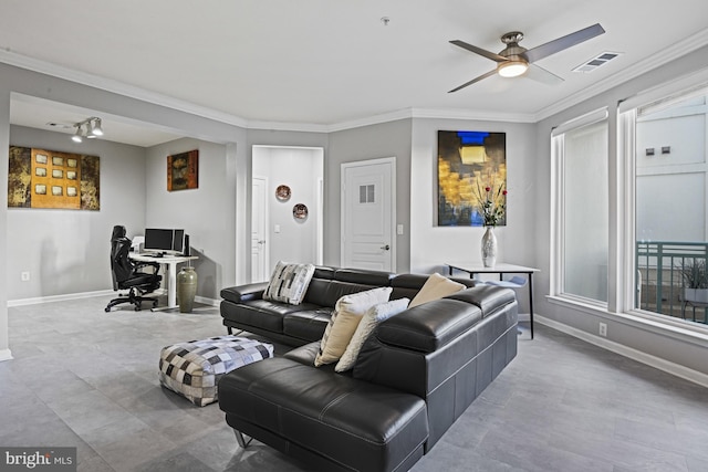 living area with crown molding, a ceiling fan, and baseboards