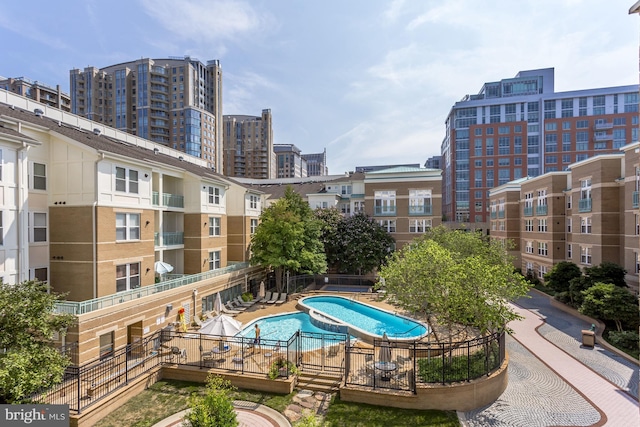 view of swimming pool with a city view