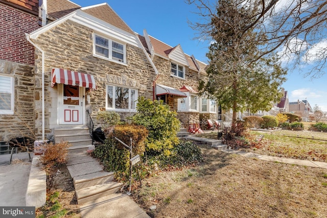 view of front of home with stone siding