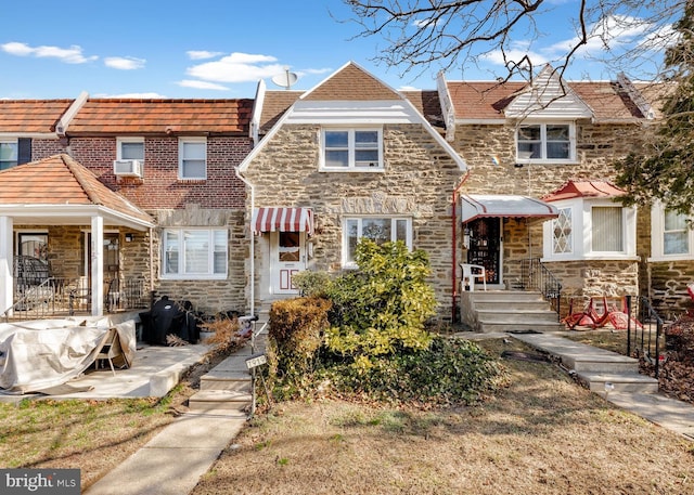 view of property with stone siding