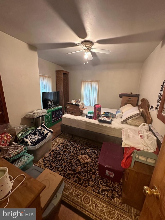 bedroom featuring wood finished floors and a ceiling fan