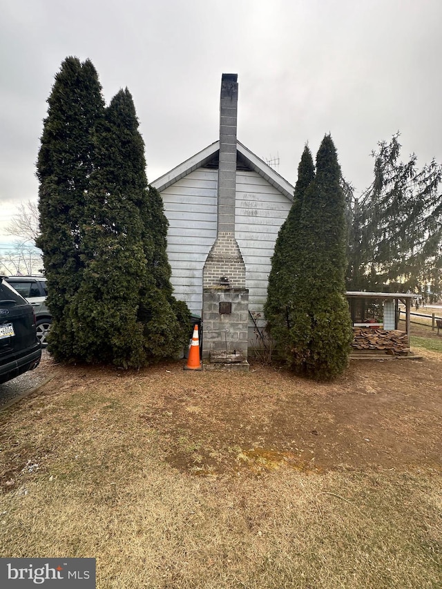 view of side of property with a chimney