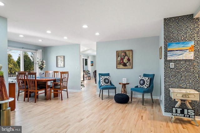 dining space featuring recessed lighting, baseboards, and wood finished floors