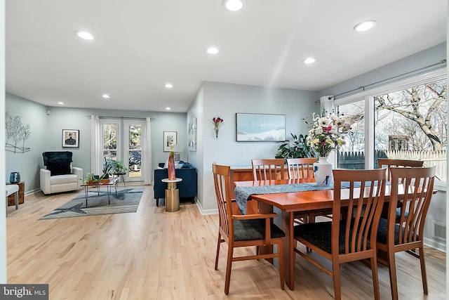 dining area with recessed lighting, baseboards, and light wood-style floors