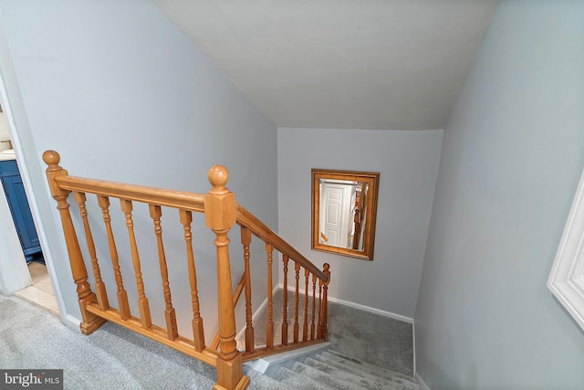 stairs with baseboards and carpet