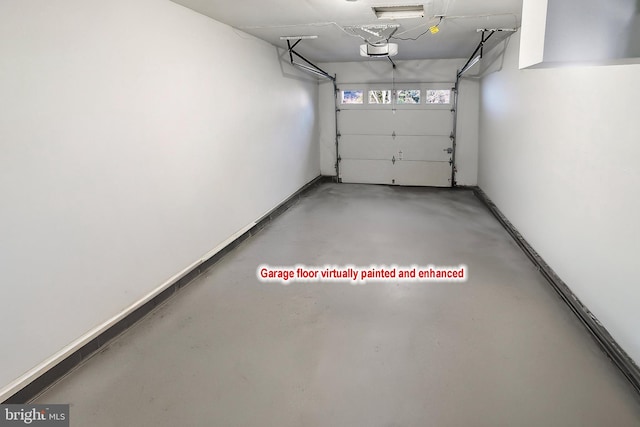 garage with a garage door opener and baseboards