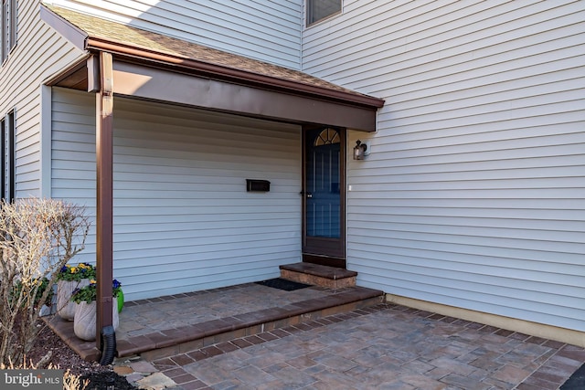 property entrance featuring a patio area